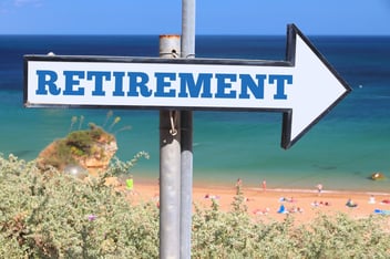 retirement-plan-arrow-sign-beach-1068x713